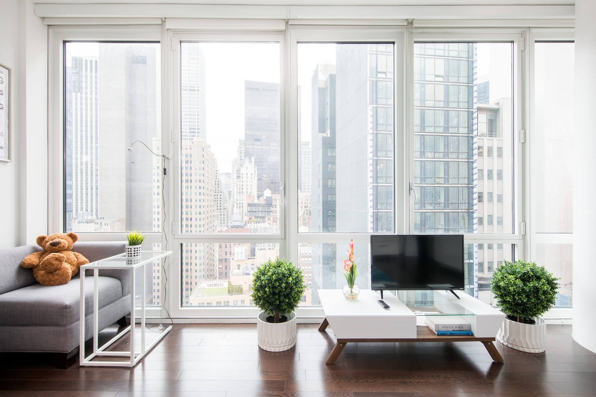 Bright interior of Brooklyn Bridge Studio with Lower Manhattan views.